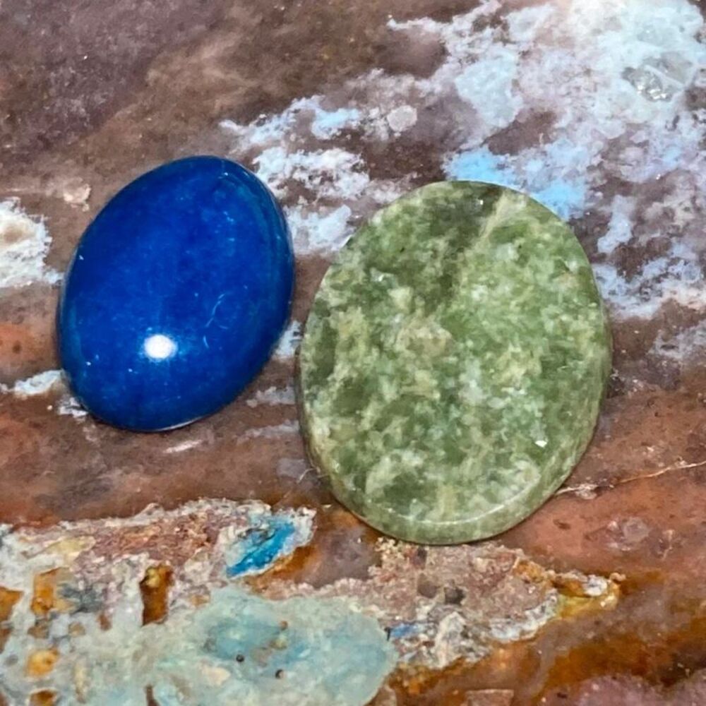 Blue and green oval cabochon gemstones set